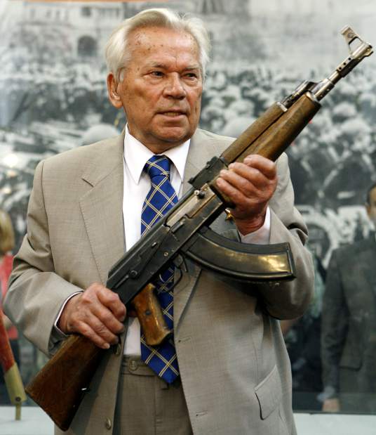 Mikhail Kalashnikov holding a AK47